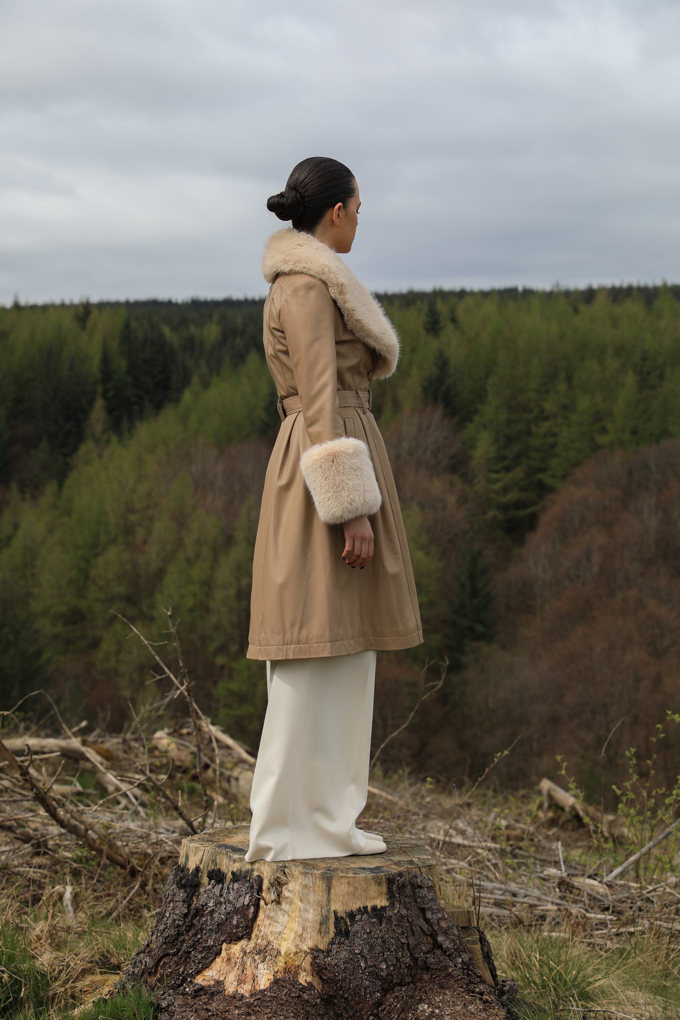 Josephine Jones' genuine leather beige trench coat featuring a faux fur collar and cuffs, exuding timeless elegance and sophisticated style.