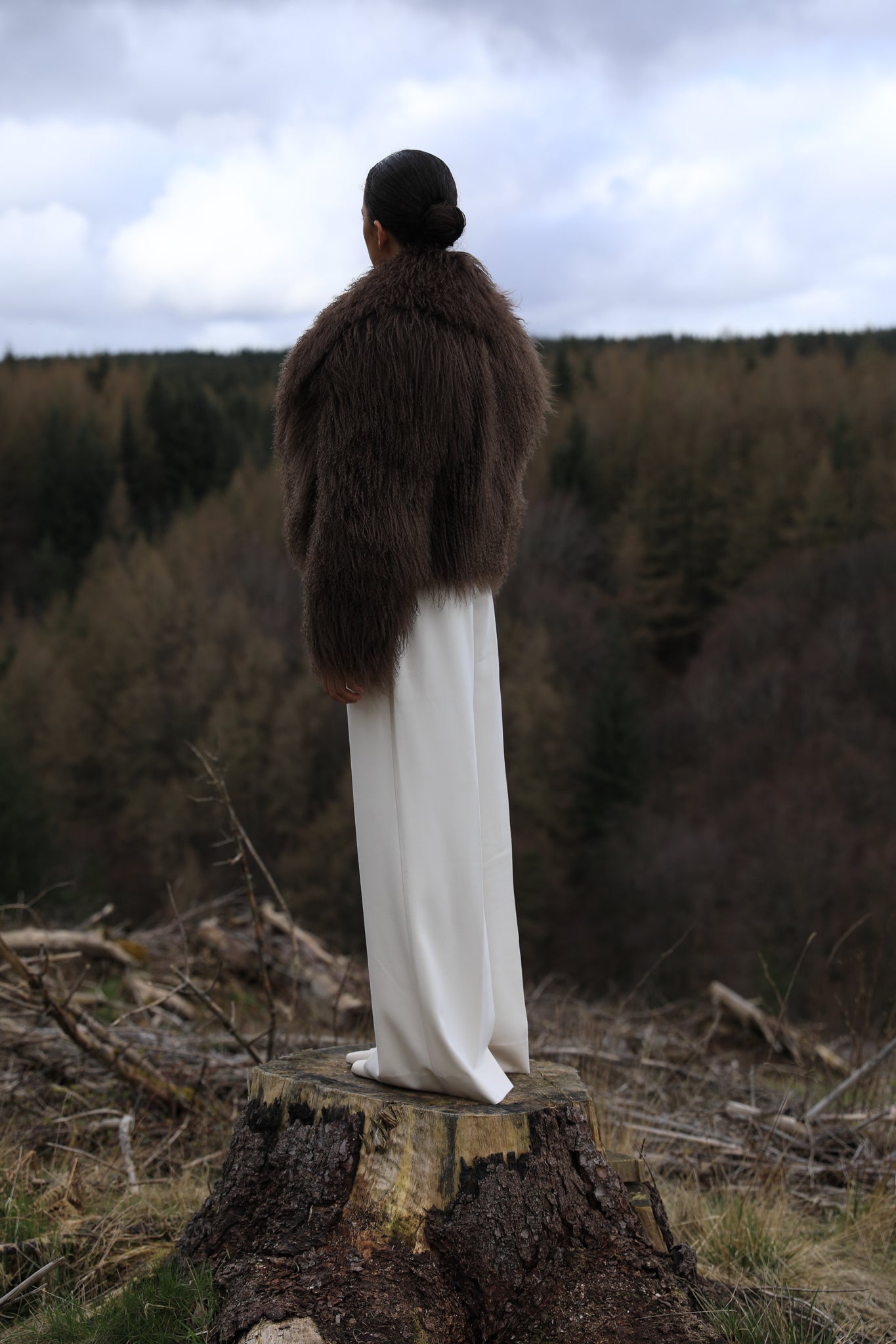 Josephine Jones' signature chocolate-colored Mongolian fur coat, featuring a voluminous collar. A luxurious staple piece perfect for adding warmth and elegance to any ensemble.