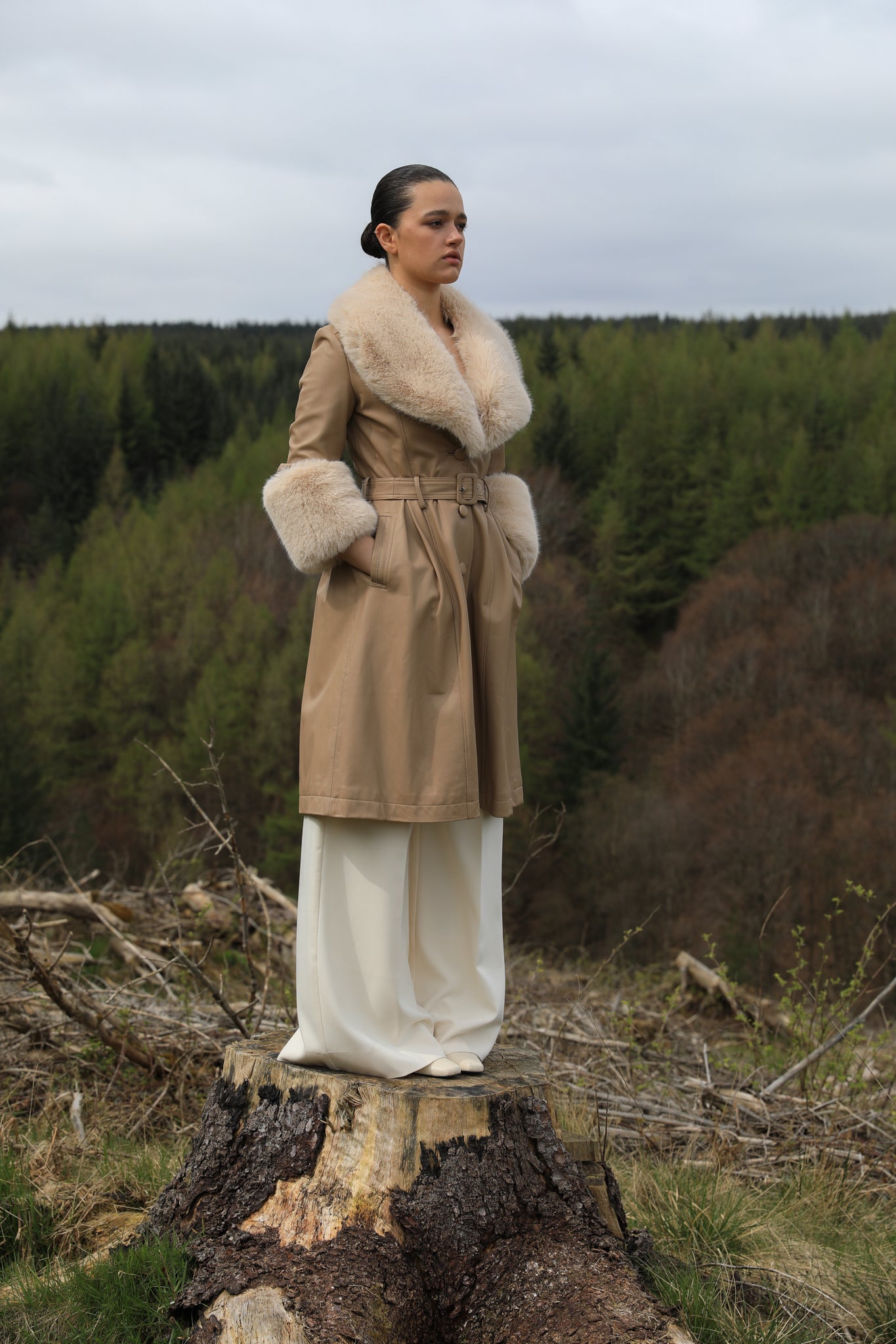 Josephine Jones' genuine leather beige trench coat featuring a faux fur collar and cuffs, exuding timeless elegance and sophisticated style.