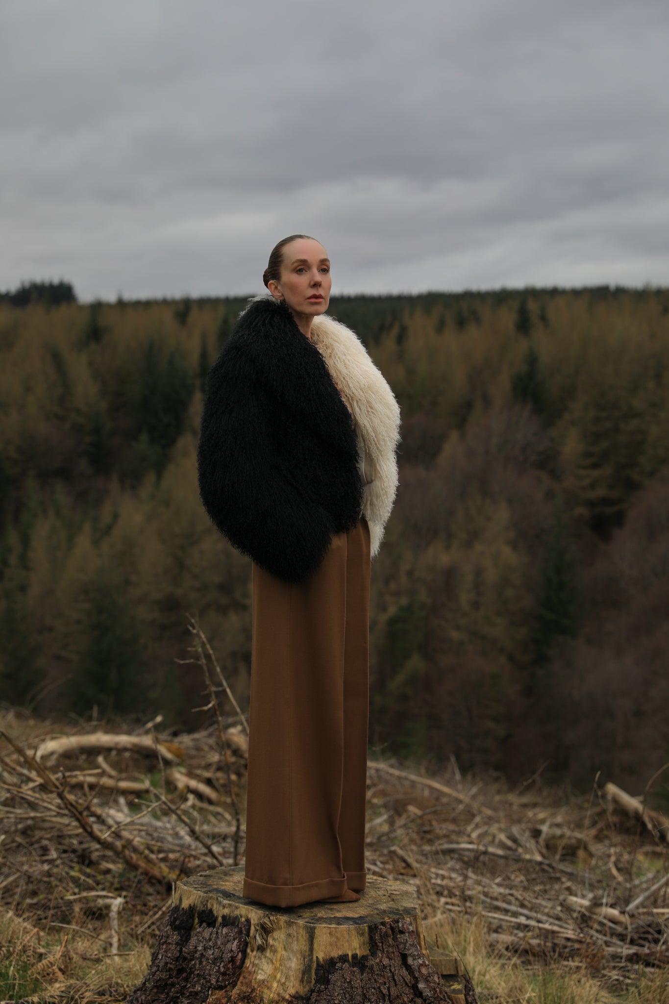 Josephine Jones' iconic Mongolian fur coat, showcasing a voluminous collar with a striking half-ivory, half-black design. A timeless statement piece for any wardrobe.