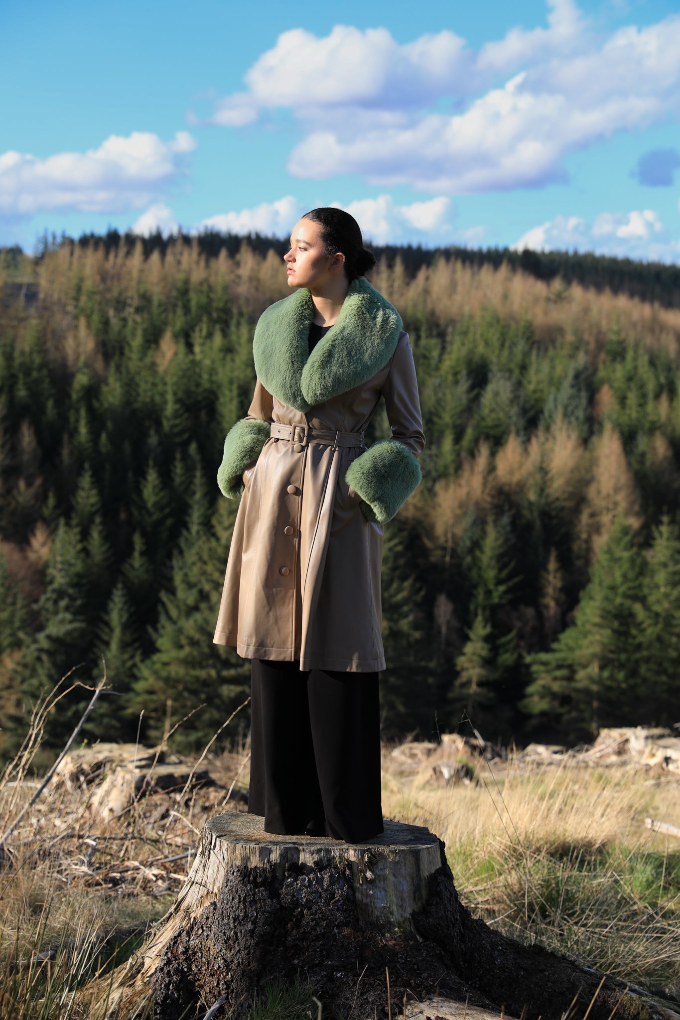 Beige trench coat with pistachio green faux fur collar and cuffs, crafted from genuine leather by Josephine Jones, offering timeless elegance and luxurious warmth for any occasion.