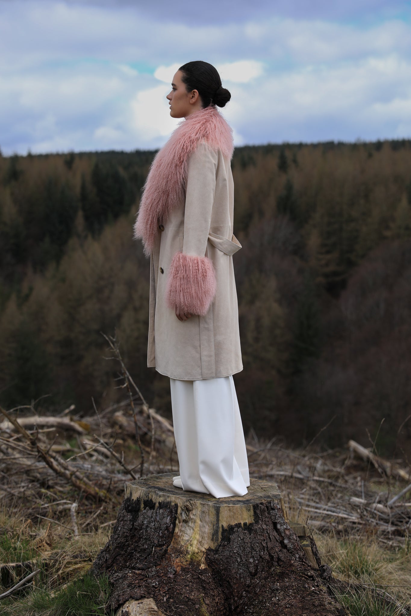 Ivory genuine suede trench wrap coat with blush Mongolian collar and cuffs, designed by Josephine Jones. Luxuriously crafted outerwear perfect for adding elegance to any ensemble.