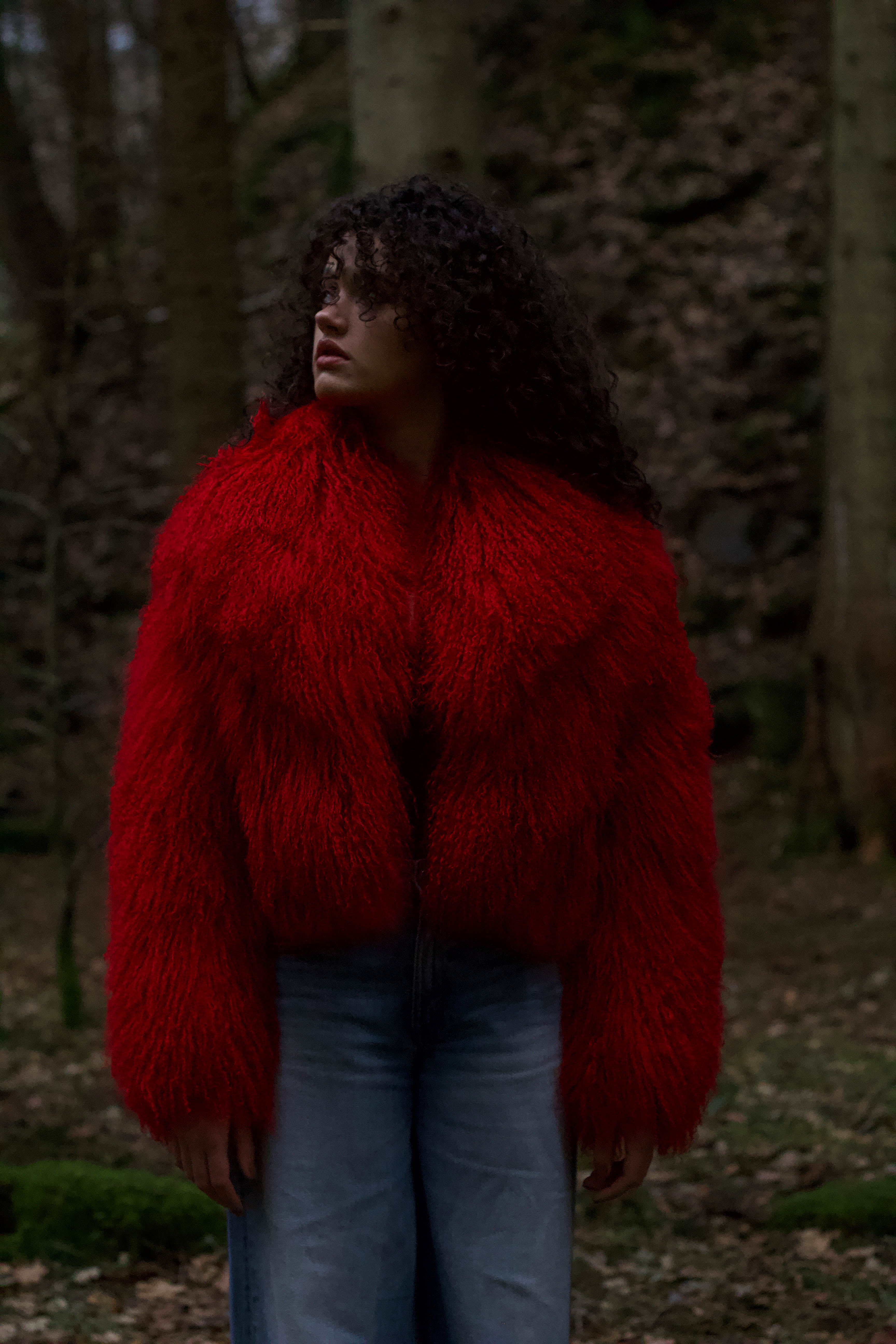 A striking red voluminous collar Mongolian fur coat from Josephine Jones, a timeless staple piece exuding elegance and luxury.