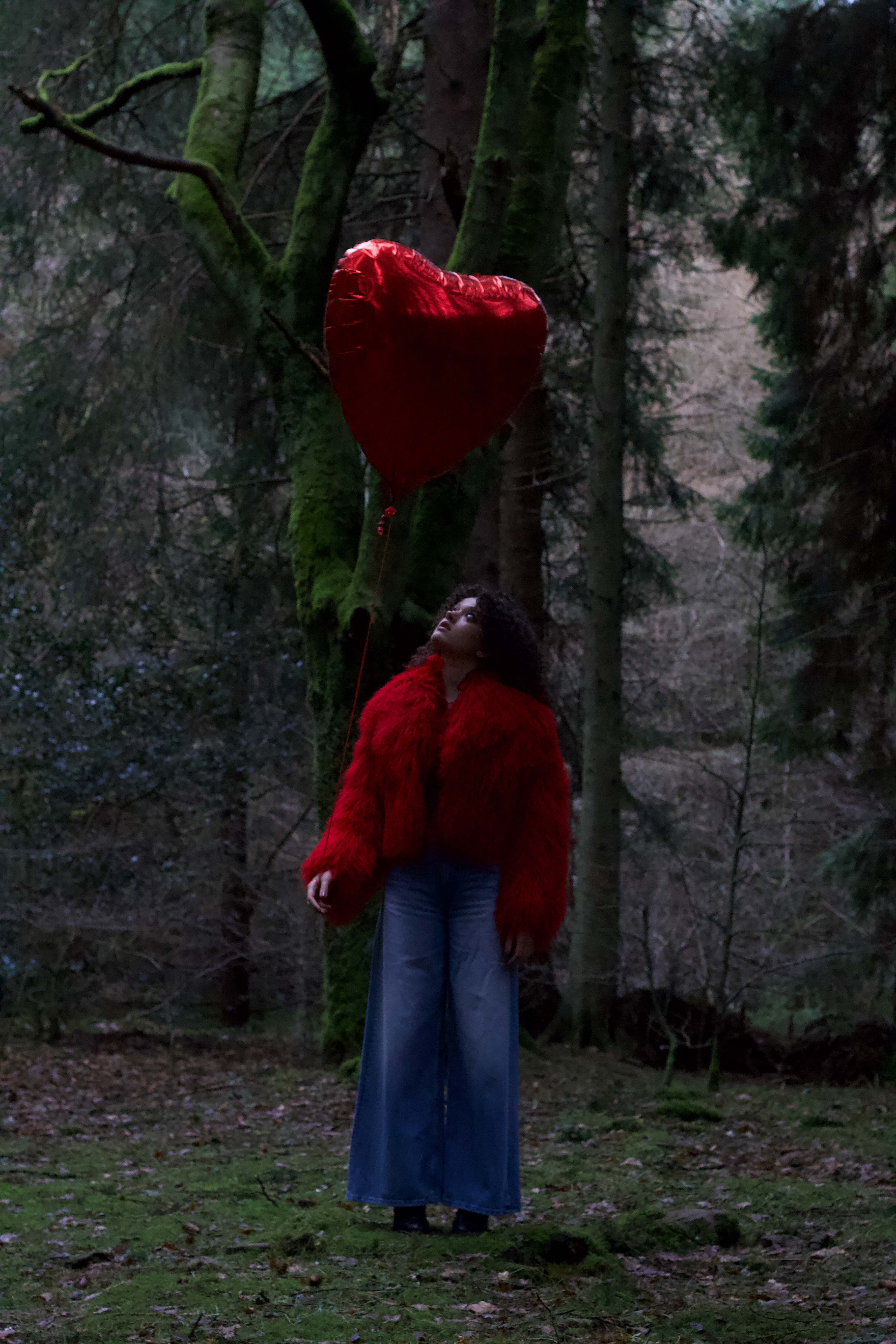 A striking red voluminous collar Mongolian fur coat from Josephine Jones, a timeless staple piece exuding elegance and luxury.