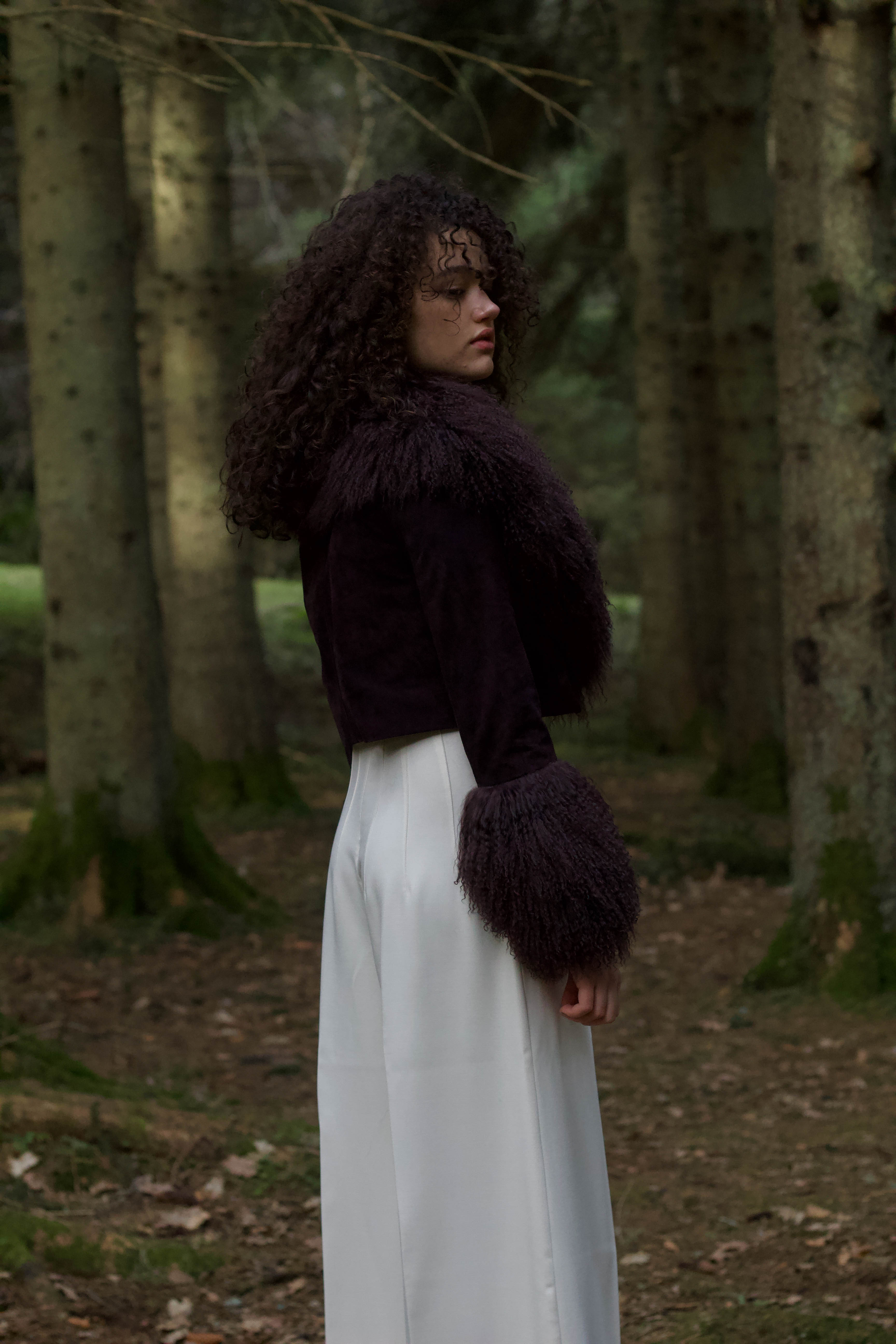 A cocoa genuine suede cropped jacket coat with a luxurious Mongolian collar and cuffs, exuding elegance and warmth. From Josephine Jones' exquisite collection of outerwear.