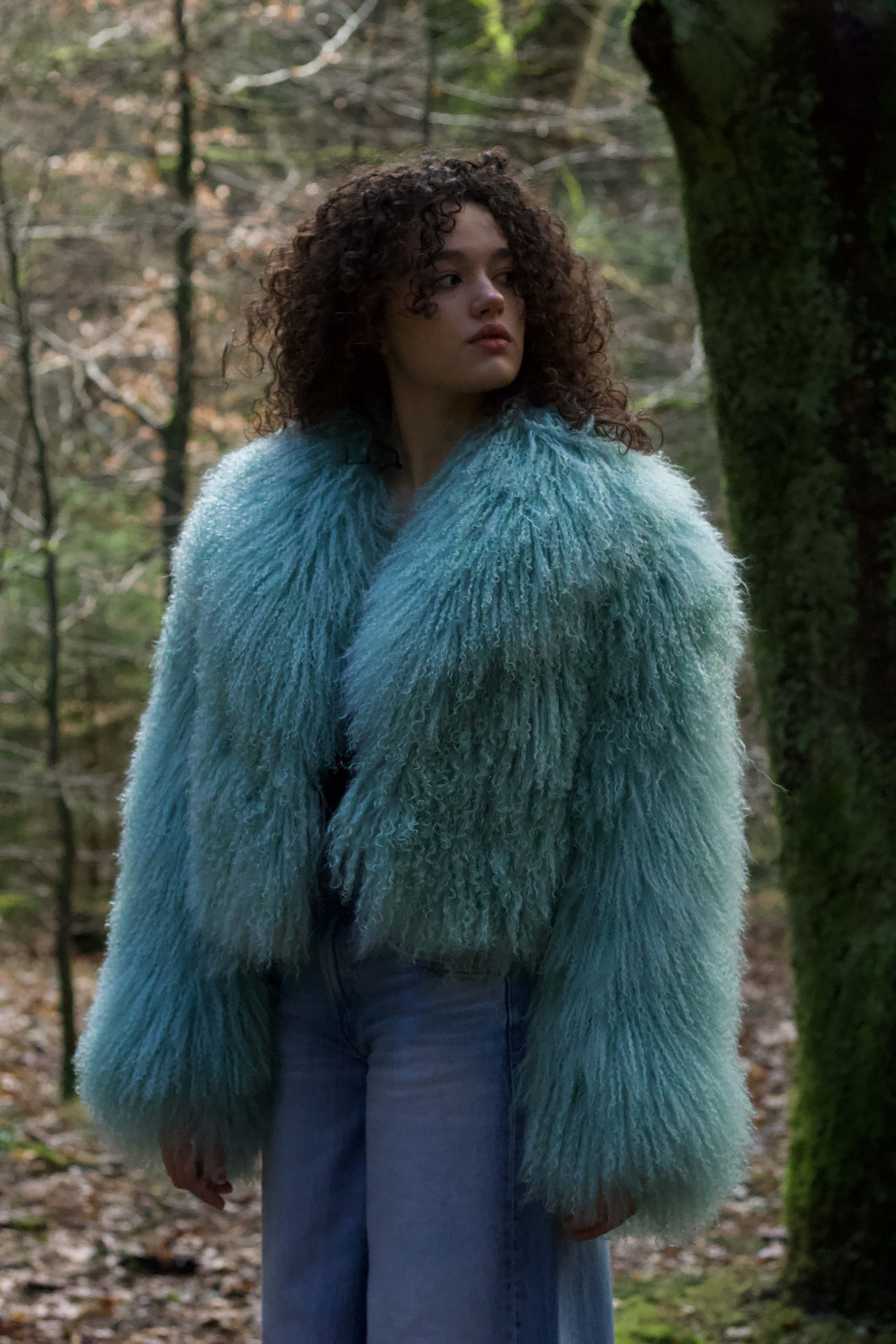 Josephine Jones' iconic mint voluminous collar Mongolian fur coat, a classic staple piece for luxurious winter fashion.