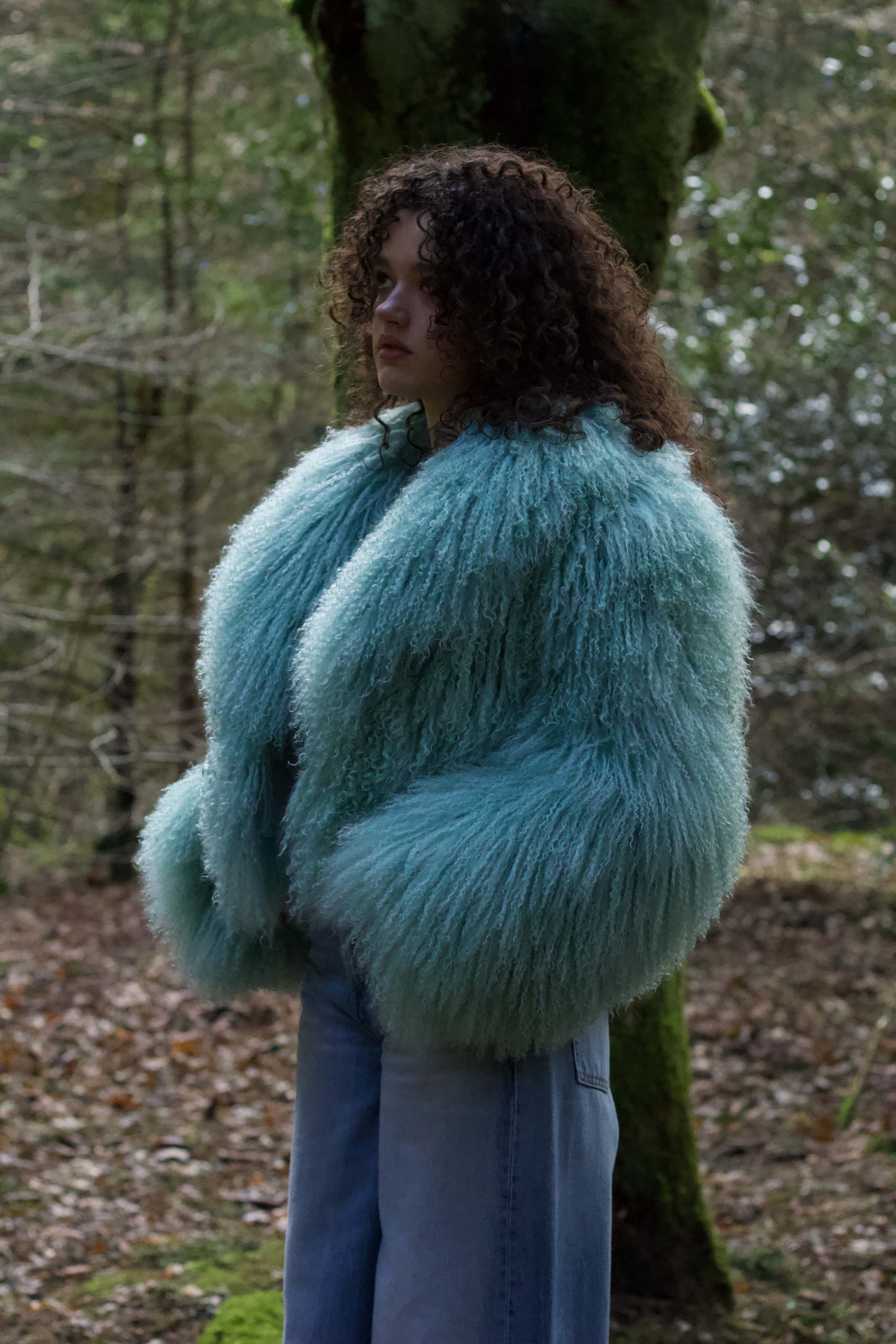 Josephine Jones' iconic mint voluminous collar Mongolian fur coat, a classic staple piece for luxurious winter fashion.