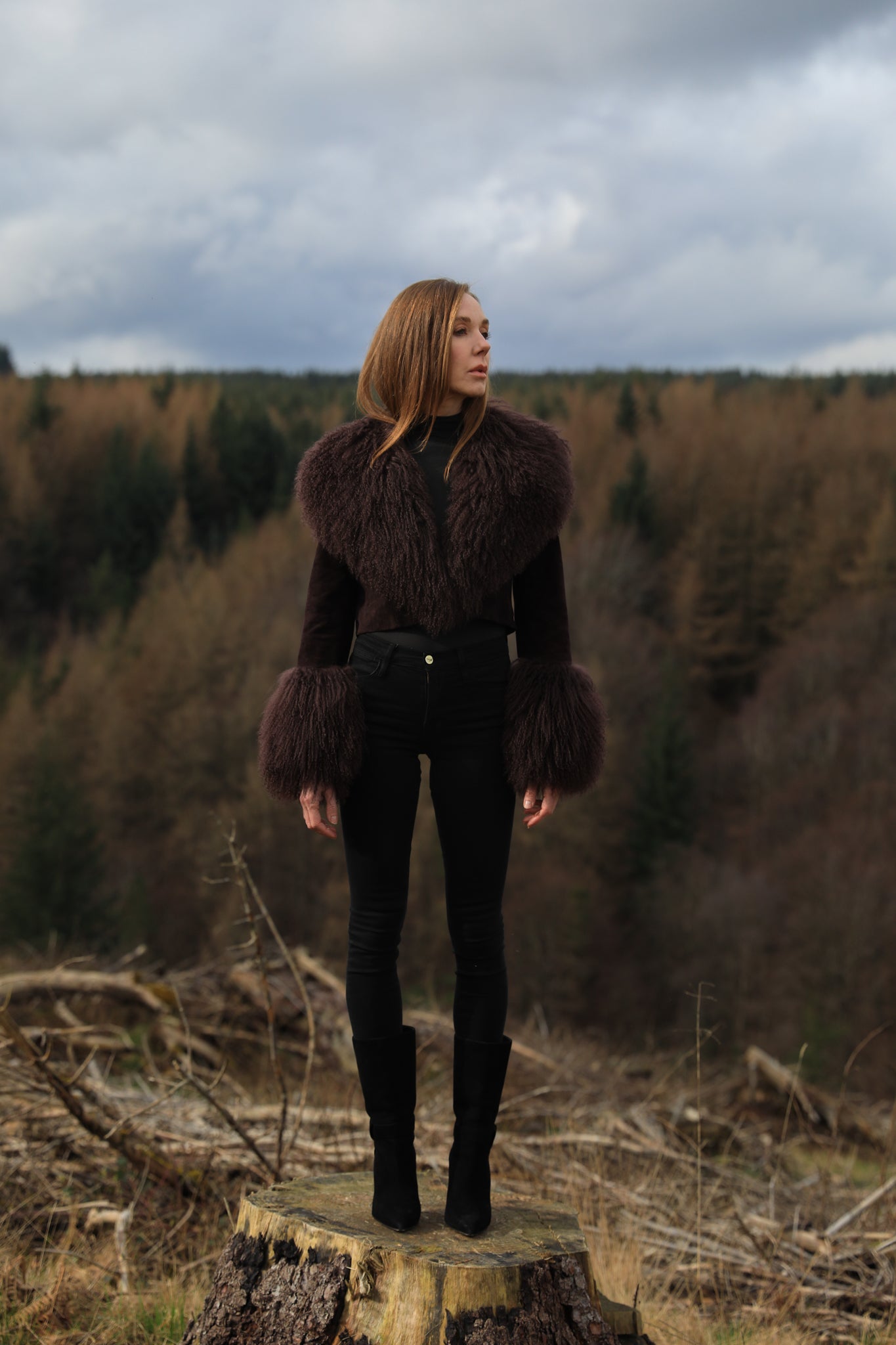 A cocoa genuine suede cropped jacket coat with a luxurious Mongolian collar and cuffs, exuding elegance and warmth. From Josephine Jones' exquisite collection of outerwear.