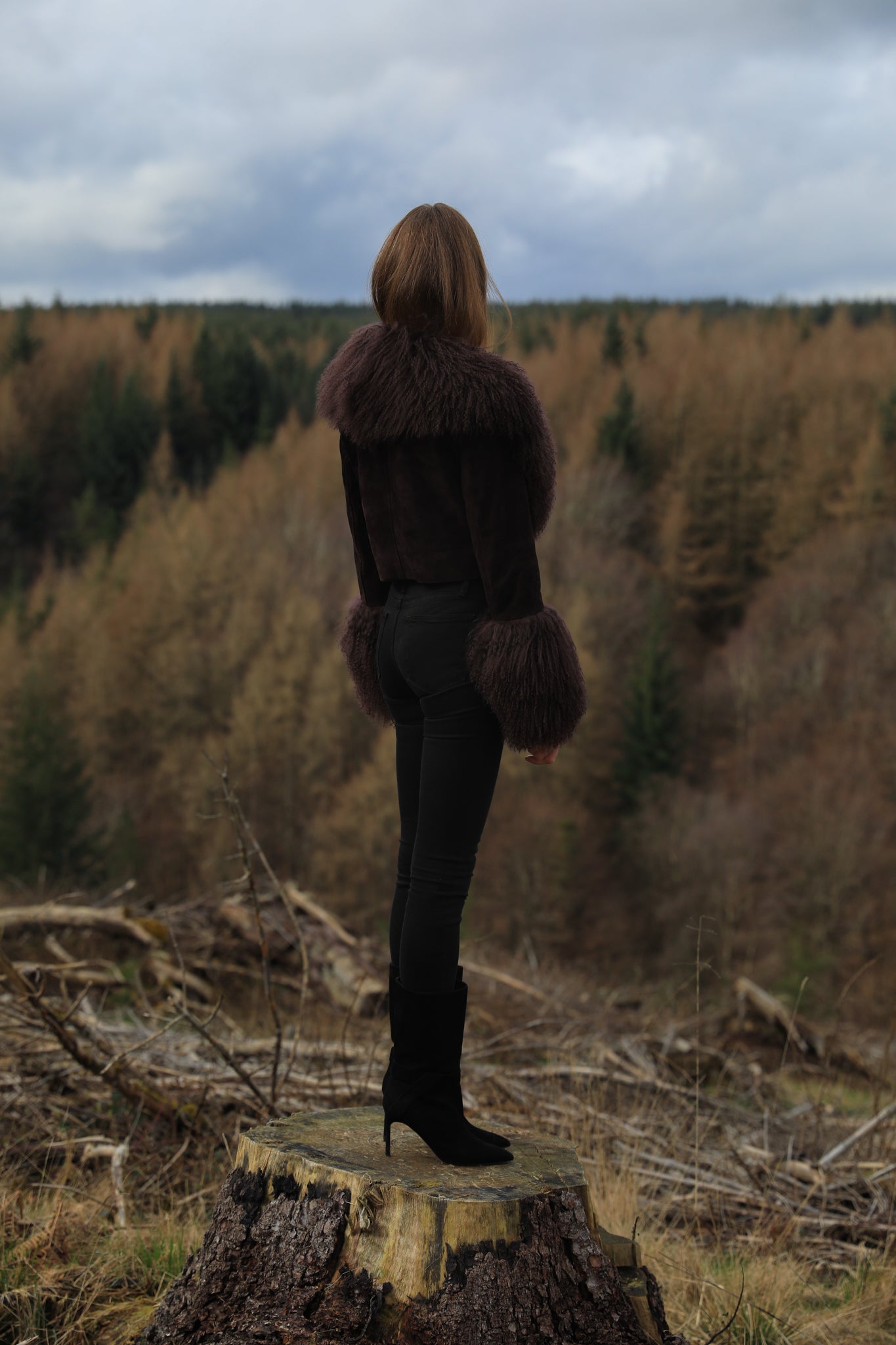 A cocoa genuine suede cropped jacket coat with a luxurious Mongolian collar and cuffs, exuding elegance and warmth. From Josephine Jones' exquisite collection of outerwear.