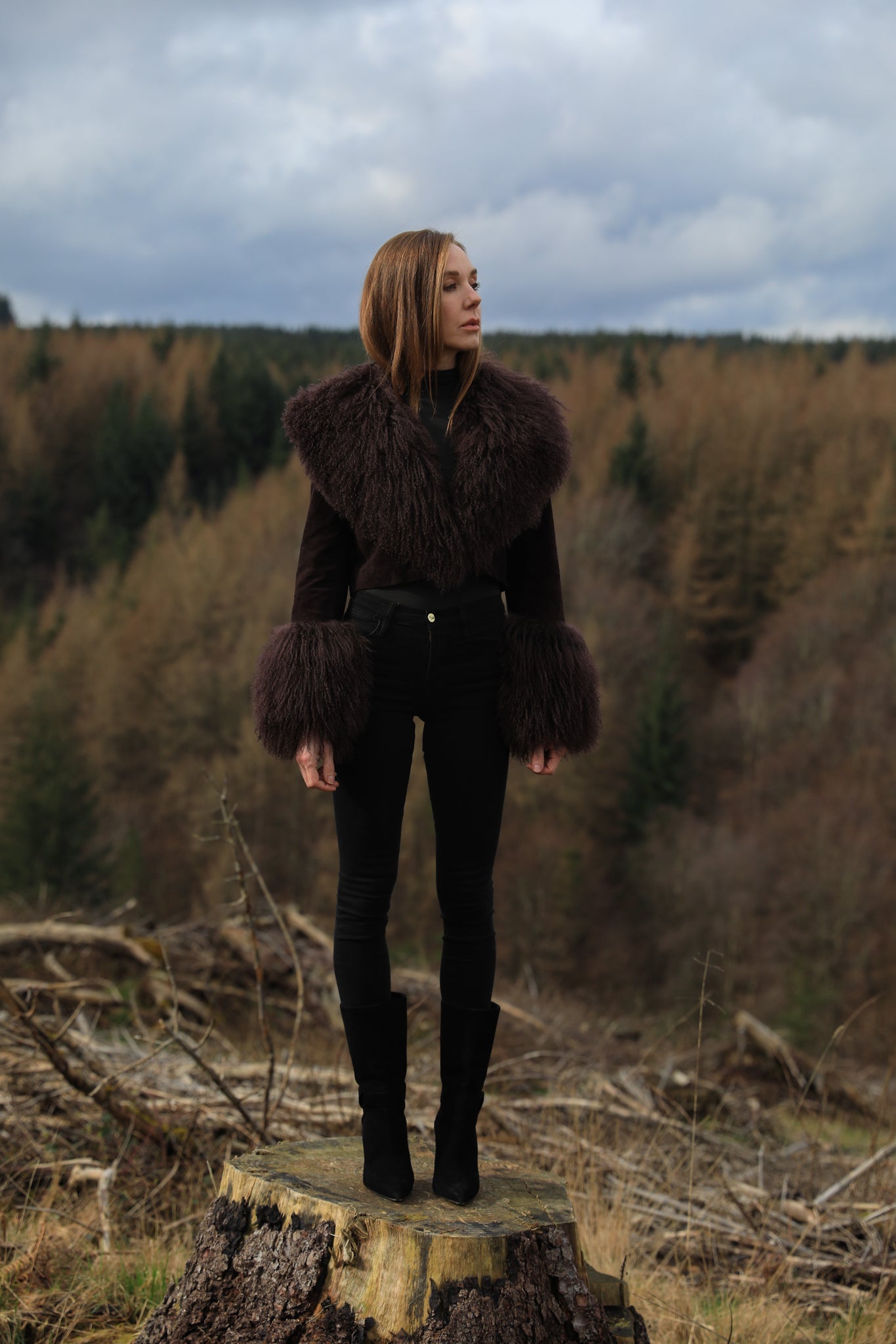 A cocoa genuine suede cropped jacket coat with a luxurious Mongolian collar and cuffs, exuding elegance and warmth. From Josephine Jones' exquisite collection of outerwear.