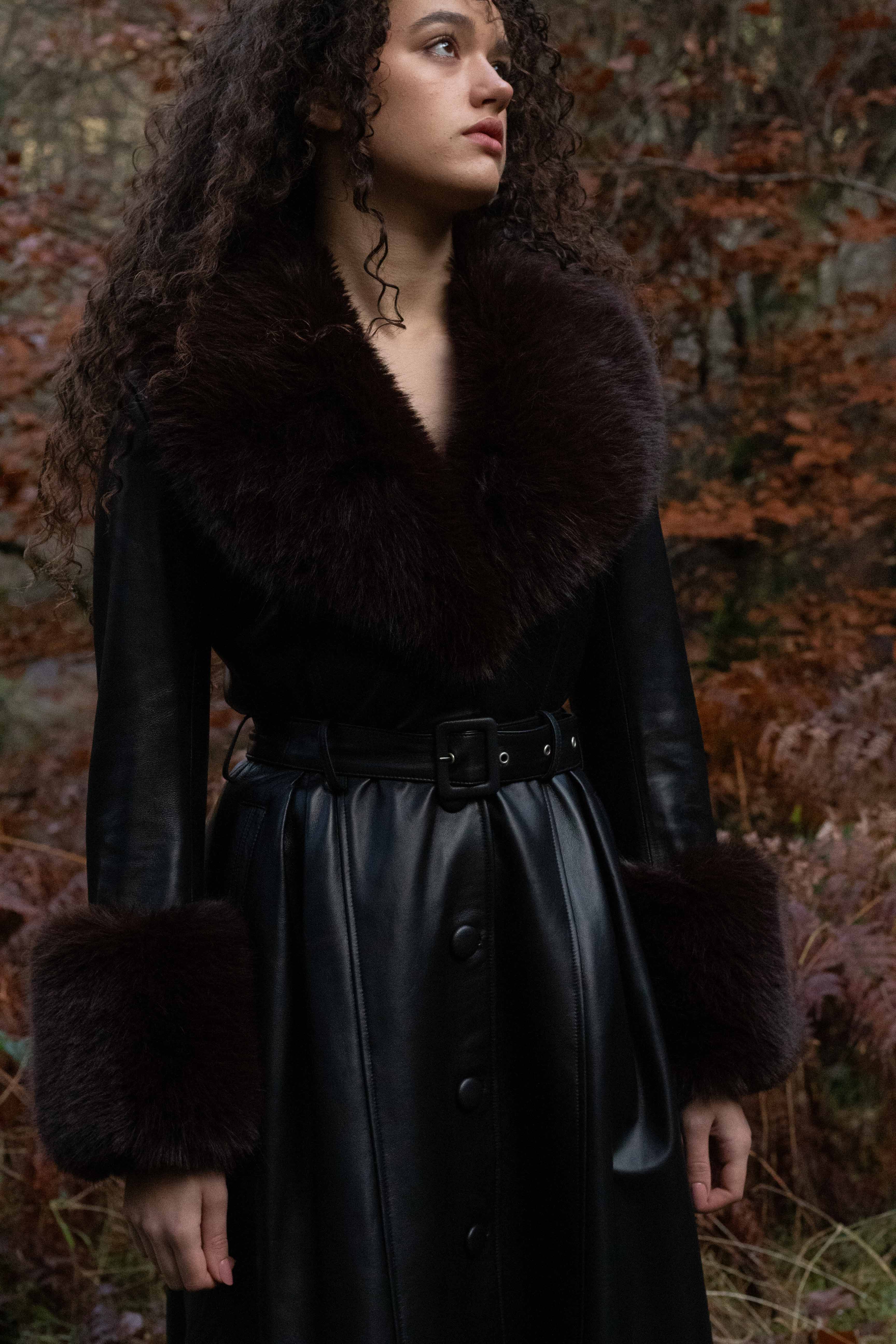 Josephine Jones genuine leather black trench coat with chocolate faux fur collar and cuffs - a timeless statement piece for any wardrobe.