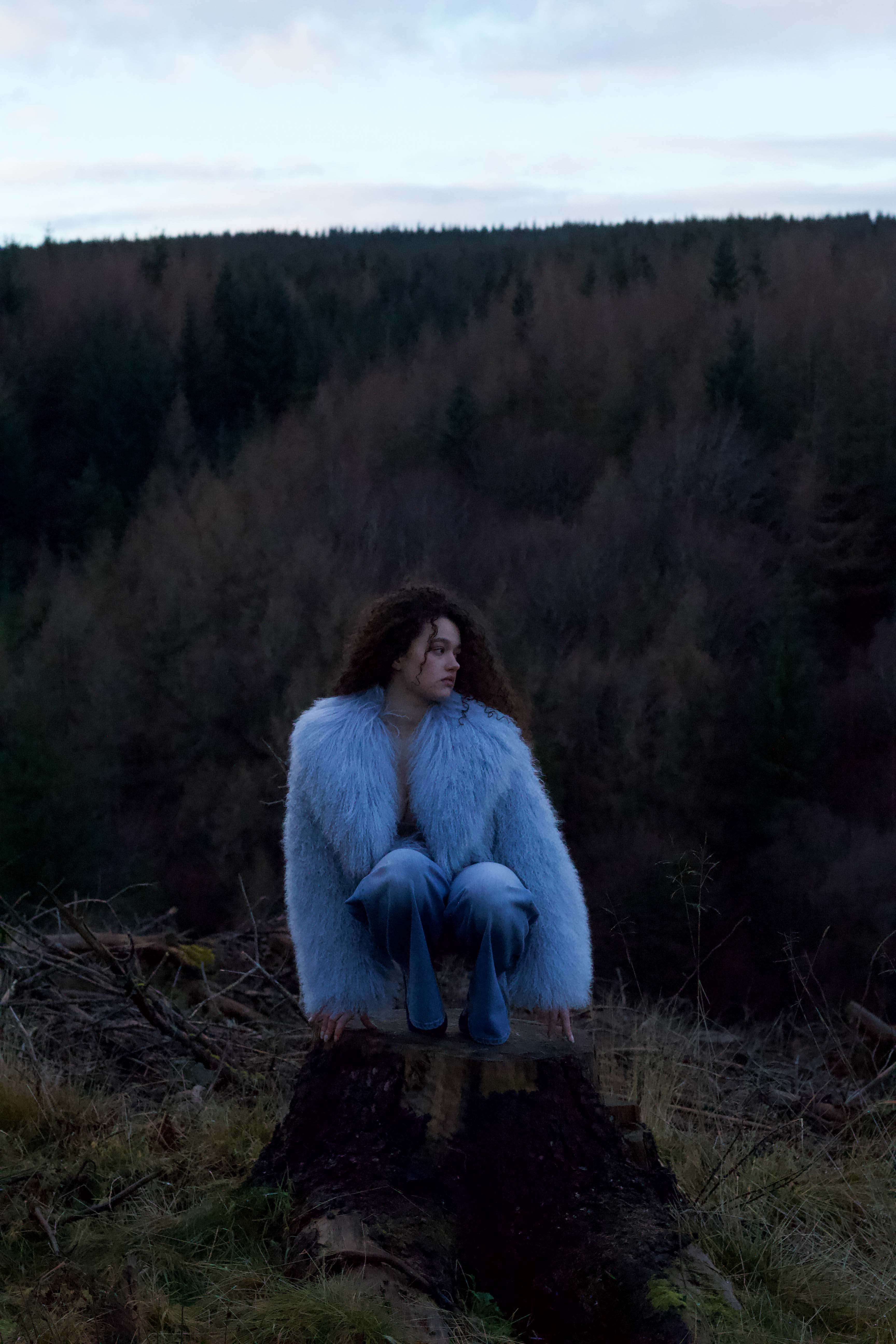 A stunning blue voluminous collar Mongolian fur coat by Josephine Jones, a timeless staple piece exuding elegance and luxury.